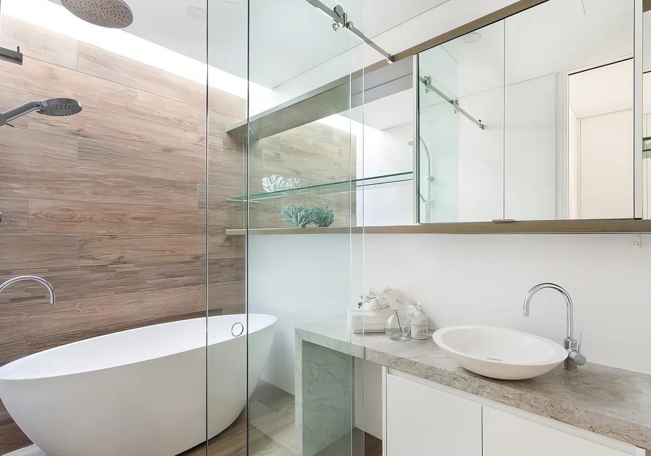 Contemporary bathroom in Blacktown featuring a freestanding bathtub, full glass shower, timber-look wall tiles, and sleek floating vanity with a vessel sink and mirrored cabinetry.